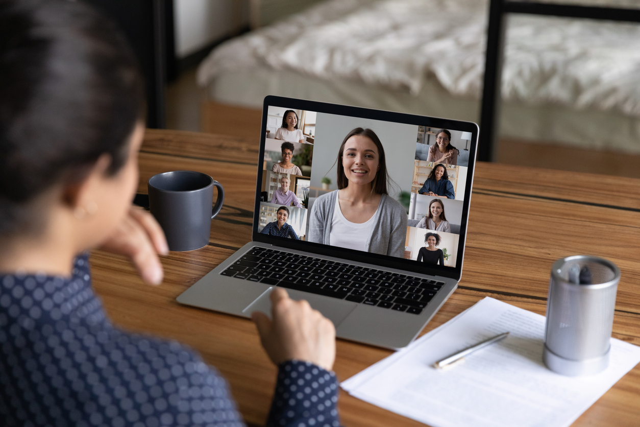 Women talk on video call on laptop at home